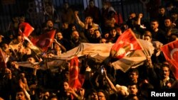 Supporters of Kemal Kilicdaroglu, presidential candidate of Turkey's main opposition alliance, react at the Republican People's Party (CHP) headquarters in Ankara, Turkey, May 15, 2023. 