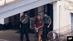 FILE - Jimmy Lai walks through the Stanley prison in Hong Kong, on July 28, 2023.