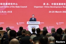 Chinese Premier Li Qiang delivers a keynote speech at the opening ceremony of the China Development Forum 2024 in Beijing, March 24, 2024. (China Daily via Reuters)