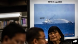 Footage of a Chinese coast guard ship using a water cannon against a Philippine resupply vessel is shown during a press conference at the Philippine Department of Foreign Affairs in Manila, Philippines, on Aug. 7, 2023.