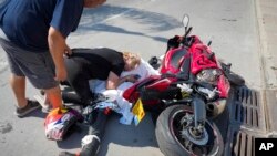 FILE - An Israeli woman reacts over the body of a relative who was killed by Hamas militants in Sderot, Israel, on Oct. 7, 2023. The United States and Britain announced on March 27, 2024, that they have imposed sanctions on a fundraising group connected to Hamas.
