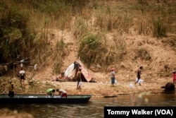 Internally displaced people from Myanmar collect aid sent from Thailand, in Mae Sot, Thailand, April 23, 2024.