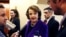 FILE — U.S. Senator Dianne Feinstein talks to reporters as she walks to the Senate floor on Capitol Hill in Washington, Dec. 9, 2014. Feinstein died Thursday at age 90.