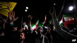 Iranian demonstrators chant slogans during an anti-Israeli gathering in front of the British Embassy in Tehran, Iran, April 14, 2024. 