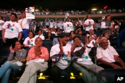 FILE - Supporters cheer as India's Prime Minister Narendra Modi gives a speech during a reception by the Indian community in honor of his visit to the United States at Madison Square Garden in New York, Sept. 28, 2014.