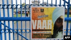 A poster advertising a tribute for Hardeep Singh Nijjar is displayed at the Guru Nanak Sikh Gurdwara temple in Surrey, British Columbia, Canada, on Sept. 19, 2023. 