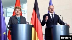 German Chancellor Olaf Scholz and Swiss Confederation President Viola Amherd speak with reporters in Berlin, Germany, about a planned Ukraine peace summit, May 15, 2024.