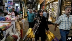 People shop at the old main bazaar of Tehran, Iran, April 24, 2024. 