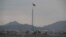FILE - A North Korean flag flutters in North Korea's village Gijungdong as seen from an South Korea's observation post inside the demilitarized zone in Paju, South Korea, during a media tour, March 3, 2023.