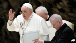 Pope Francis delivers his blessing at the end of his weekly general audience in the Paul VI Hall at the Vatican, Dec. 27, 2023.