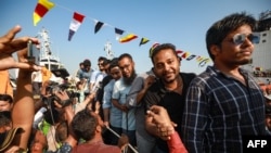 Crew members of the MV Abdullah ship arrive at the Chattogram Port after their release by the Somali pirates, in Bangladesh, on May 14, 2024. 