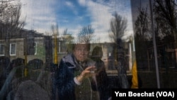 A former Bakhmut resident who was living in a shelter in Konstiantynivka, Ukraine waits to be evacuated to a safer city on April 11, 2023.