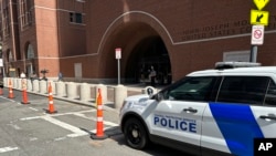 A federal police vehicle is parked outside U.S. District Court in Boston, Massachusetts, April 14, 2023 as Massachusetts Air National Guardsman Jack Teixeira appears for an initial hearing.