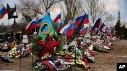 FILE - Graves of Russian servicemen killed in Ukraine are seen in a cemetery in Russia’s Volgograd region on March 30, 2024. 