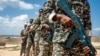 FILE - Troops take part in Somali army training in Mogadishu on March 19, 2024. Two government soldiers are among the 12 dead in fighting with local militias near the border with Ethiopia on July 16, 2024.