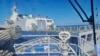 In this photo provided by the Philippine Coast Guard, a Chinese coast guard ship, front, allegedly blocks the path of a Philippine coast guard ship near the Philippine-occupied Second Thomas Shoal, South China Sea, during a resupply mission Aug. 5, 2023.
