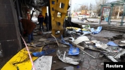 Wreckage lies on the ground at a bus station damaged after Russian shelling in Kherson, Ukraine, Feb. 21, 2023.