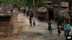 FILE - Children from impoverished families play in their village on the outskirts of Samastipur, in Bihar, India, on May 12, 2024.