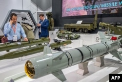 Guided missiles are displayed at the Russian pavilion during the International Defense Exhibition (IDEX) at the Abu Dhabi International Exhibition Centre, Feb. 20, 2023.
