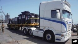 In this photo provided by US Central Command, humanitarian aid arrives in Gaza, June 8, 2024.