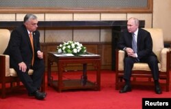 Russian President Vladimir Putin attends a meeting with Hungarian Prime Minister Viktor Orban ahead of the Belt and Road Forum in Beijing, China, Oct. 17, 2023. (Sputnik/Grigory Sysoyev/Pool via Reuters)