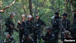 Members of the People's Defence Forces (PDF) who became guerrilla fighters after being protesters are seen on the front line in Kawkareik on December 31, 2021. (Reuters)