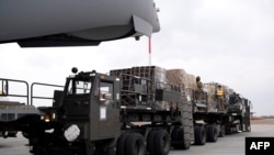 FILE - A handout photo taken March 4, 2022 shows a Royal Australian Air Force C-17A Globemaster delivering defensive military assistance to the Ukrainian Government at an undisclosed location. (Photo by Handout / Australia Defence Force/ AFP)