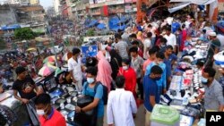 FILE - People shop at a market in Dhaka, Bangladesh, July 16, 2021. According to the Bangladesh Bureau of Statistics, the country's GDP expanded by 3.78% in the second quarter of the current fiscal year, down from 7% a year earlier. 