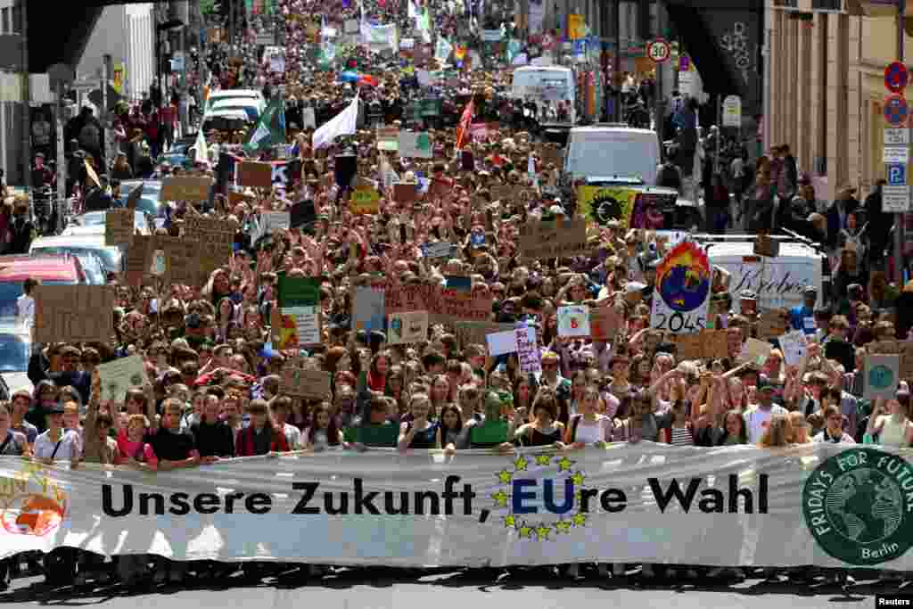 Protesters hold a banner that reads "Our future, your vote," as Fridays for Future demonstrates for a social and climate-friendly Europe, in Berlin, Germany.