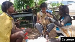 Melkamsew Solomon (2nd from right) interviews women of the Benna tribe in the south of Ethiopia, in 2020. (Photo courtesy of Solomon Yohannes)
