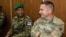 Botswana Defense Forces 1st Lieutenant Maria Gabaikanngwe and U.S. Army Master Sergeant Hernan Briones take part in a planning meeting for the South Accord 2024 exercises in Gaborone, Botswana, on June 19, 2024. The exercises, in Botswana, wrap up on Aug. 15, 2024.
