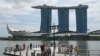 People take pictures on the jetty at Marina Bay waterfront in Singapore, Nov. 17, 2023.