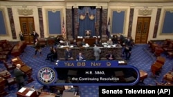 This image from a U.S. Senate video shows the vote, 88-9, on a temporary funding bill in the Senate at the U.S. Capitol in Washington, Sept. 30, 2023. The bill is headed to President Joe Biden for his signature to avert a federal government shutdown. (Senate Television via AP)