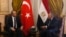 Turkish Foreign Minister Mevlut Cavusoglu, left, meets with Egyptian Foreign Minister Sameh Shoukry at Tahrir Palace in Cairo on March 18, 2023.
