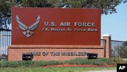 FILE - The entrance to F.E. Warren Air Force Base is pictured May 24, 2018, in Cheyenne, Wyo. President Joe Biden on May 13, 2024, issued an order blocking a Chinese-backed cryptocurrency mining firm from owning land near the base.