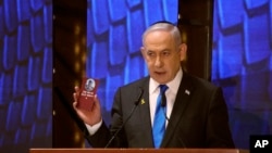 Israeli Prime Minister Benjamin Netanyahu attends a ceremony marking Memorial Day for fallen soldiers of Israel's wars and victims of attacks at Jerusalem's Mount Herzl military cemetery, May 13, 2024.