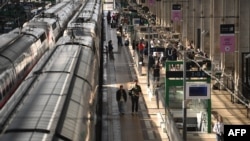 Passengers walk on train platform at the Bordeaux-Saint-Jean train station in Bordeaux, western France on July 26, 2024, as France's high-speed rail network was hit by an attack disrupting the transport system.
