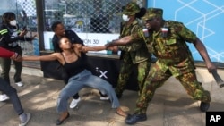 Police officers arrest a demonstrator protesting against proposed tax hikes in a finance bill that is due to be tabled in parliament in Nairobi, Kenya, June 18, 2024.