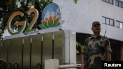 A paramilitary soldier stands guard outside Le Meridien hotel during a rehearsal ahead of the G20 Summit in New Delhi, India, Sept. 2, 2023. 