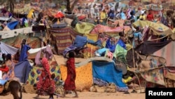 FILE - Sudanese refugees who fled the conflict in Sudan's Darfur region are seen in a makeshift camp near the border between Sudan and Chad, in Borota, Chad, May 13, 2023.