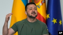 Ukrainian President Volodymyr Zelenskyy speaks during a joint news conference with Spain's Prime Minister Pedro Sanchez at the Moncloa Palace in Madrid, Spain, May 27, 2024.
