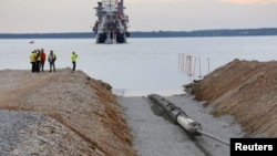 FILE - A view of the Balticconector pipeline as it is pulled into the sea in Paldiski, Estonia, in an undated handout photo taken in 2019. (Elering via Reuters)