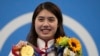 FILE - Zhang Yufei of China poses with her gold medal after winning the women's 200-meter butterfly final at the 2020 Summer Olympics, on July 29, 2021, in Tokyo, Japan. 