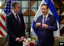 U.S. Secretary of State Antony Blinken, left, meets with Israeli President Isaac Herzog in Tel Aviv, May 1, 2024.