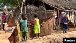 FILE - Displaced Sudanese children stand at Zamzam camp in North Darfur, Sudan, Aug. 1, 2024. Since the war in Sudan broke out in April 2023, more than 10.2 million people have been displaced, according to the UN Refugee Agency known as UNHCR.