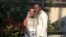 FILE - In this Nov. 9, 2018, photo provided by Nikese Toussaint, Jean-Dickens Toussaint and his wife, Abigail Michael Toussaint, pose for a photo at their wedding in Pompano Beach, Florida. 