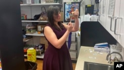 Gwendolyn Herzig prepares to administer a shot of testosterone for a patient at Park West Pharmacy in Little Rock, Arkansas, Feb. 22, 2023.