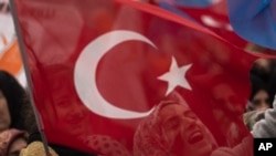 Supporters of People's Alliance's presidential candidate Recep Tayyip Erdogan chant slogans during an elections campaign rally in Istanbul, Turkey, May 12, 2023. 