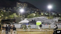 Security forces stand around a stage that collapsed due to a gust of wind during an event attended by presidential candidate Jorge Álvarez Máynez in San Pedro Garza García, on the outskirts of Monterey, Mexico, May 22, 2024.