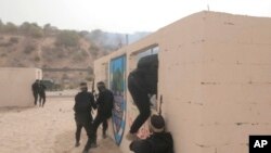 This image from video posted to social media by Hamas on Sept. 12, 2023, shows a live-fire exercise dubbed operation "Strong Pillar" outside Al-Mawasi, a Palestinian town on the southern coast of the Gaza Strip. (Hamas via AP)